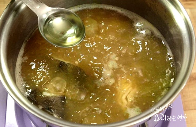 Simmer the doenjang soup — step photo 2