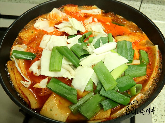 Add ingredients, seasonings, and simmer — step photo 2