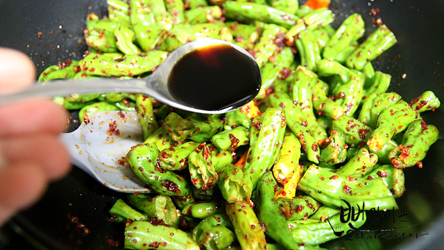 Stir-fry the shishito peppers — step photo 1