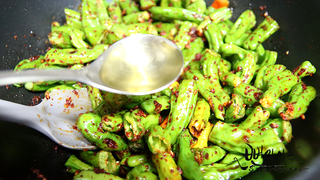 Stir-fry the shishito peppers — step photo 2