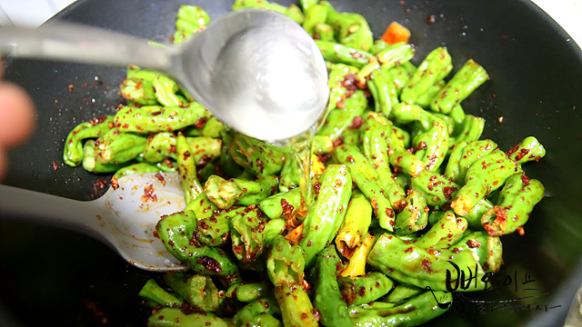 Stir-fry the shishito peppers — step photo 1