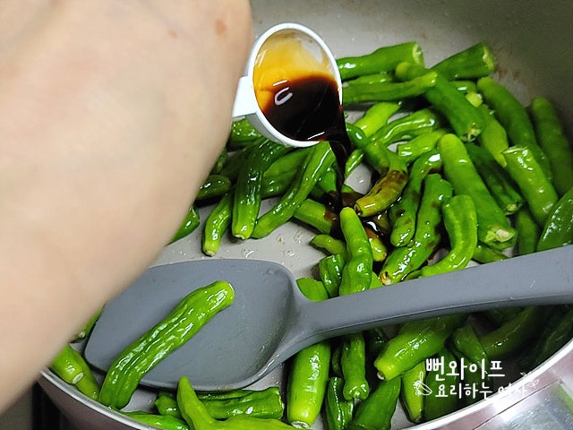 Stir-fry the shishito peppers — step photo 2