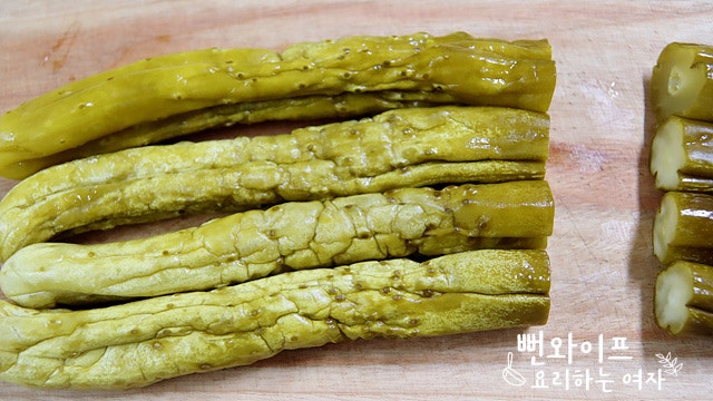 Slice the pickled cucumbers — step photo 1