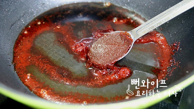 Simmer the shishito peppers in the sauce — step photo 1
