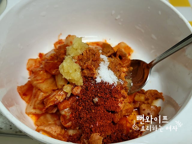 Season and stir-fry the kimchi — step photo 2