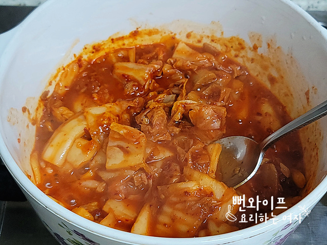 Season and stir-fry the kimchi — step photo